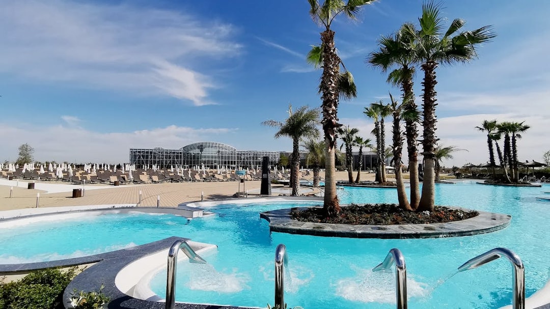 Therme Bucuresti Spa pools with palm trees in Bucharest, Romania.
