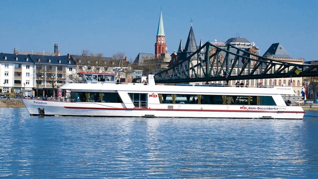 Cruise ship on the Main River with Frankfurt skyline in the background.