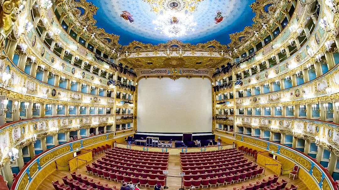 Fenice Theater interior with ornate balconies and stage, Venice, Italy.