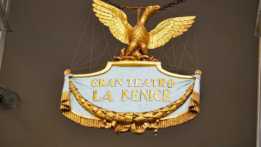 Gran Teatro La Fenice sign with golden eagle in Venice, Italy.