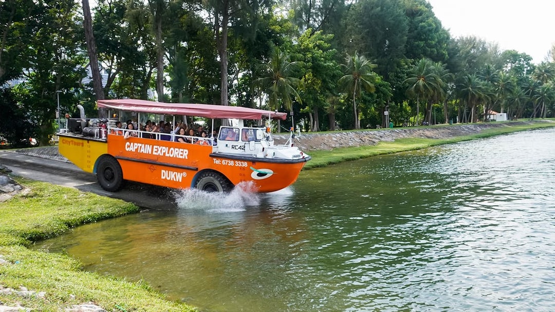 Captain Explorer DUKW vehicle entering water on a scenic tour.