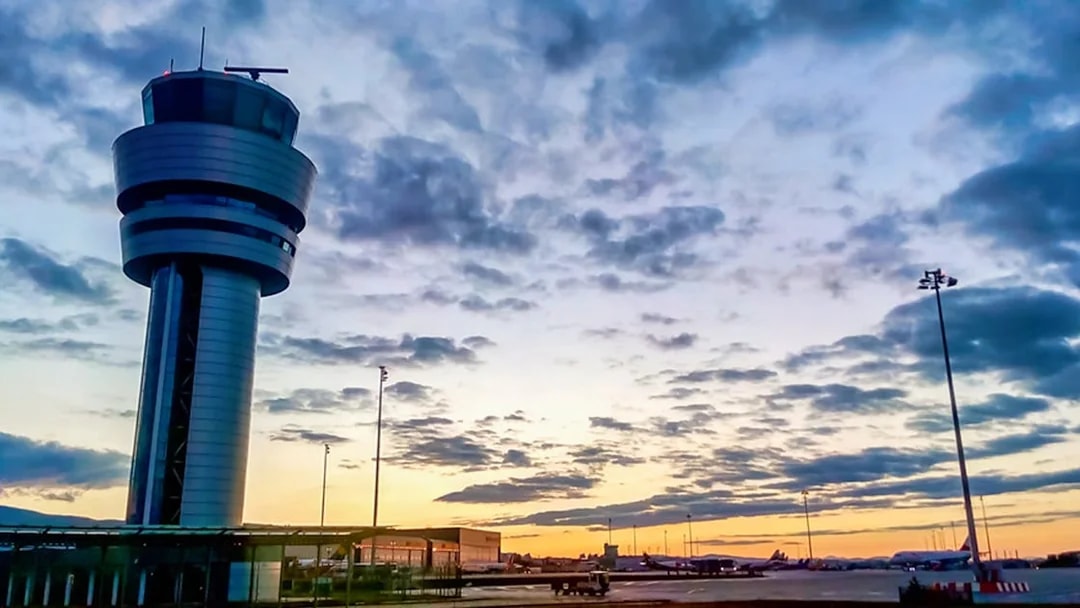 Control tower at Henri Coandă Airport during sunset, Bucharest.