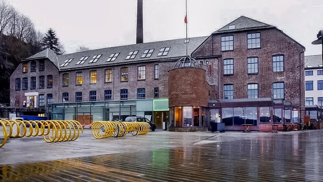 Historic brick building in Bergen, Norway, seen during a sightseeing cruise.