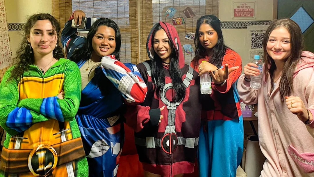 Participants in costume preparing for the 1-Hour Original Street Go-Kart Experience in Osaka Namba.