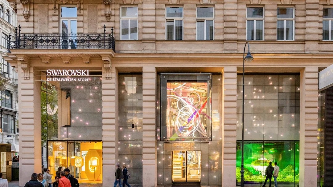 Swarovski Kristallwelten Store facade in Vienna, featuring illuminated displays.