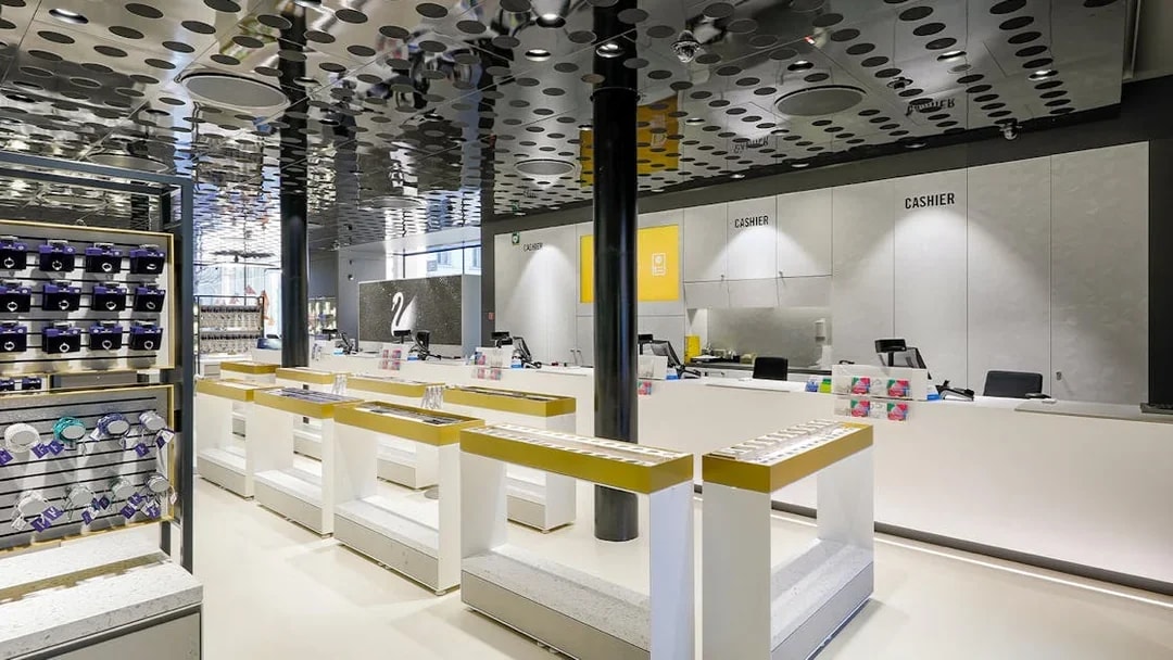 Swarovski House interior in Vienna with display counters and gift items.