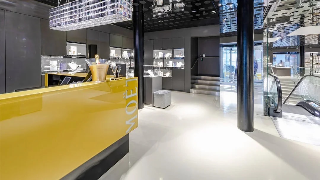 Swarovski House interior in Vienna with champagne display and jewelry showcases.