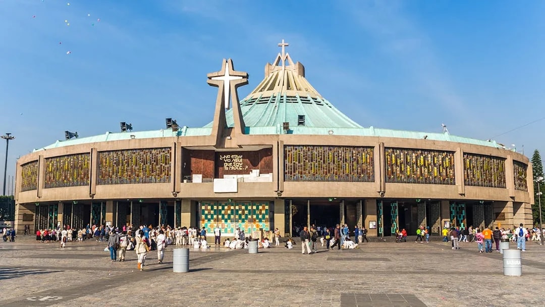 Basilica of Guadalupe exterior with visitors in Mexico City.