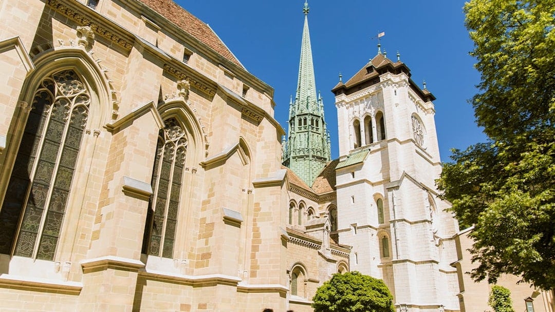 St. Pierre Cathedral in Geneva with its iconic spire on a sunny day.