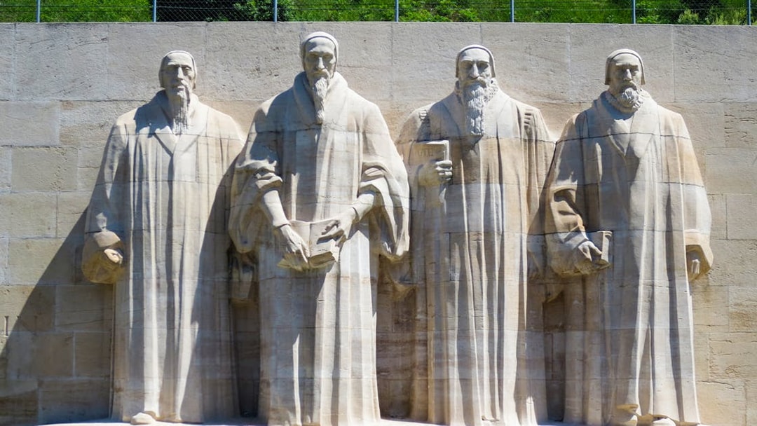 Reformation Wall statues in Geneva, featured on a 2-hour guided tour.