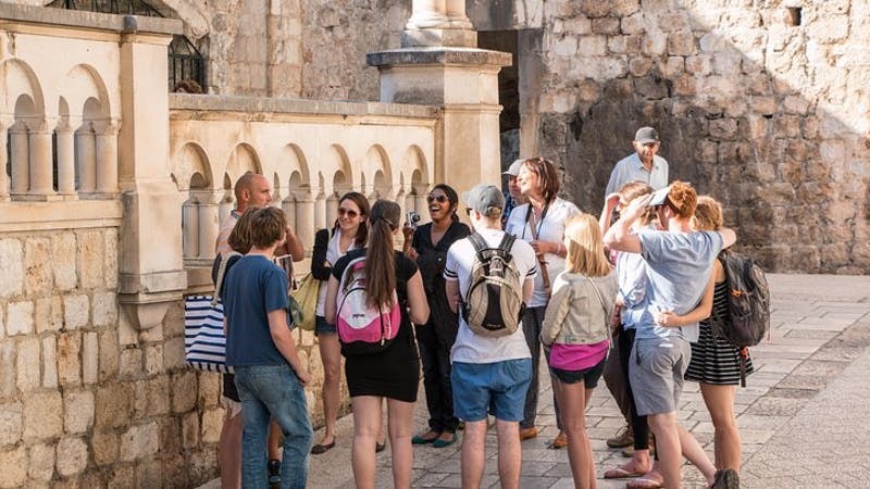 Tour group exploring Dubrovnik's historic walls on Game of Thrones tour.