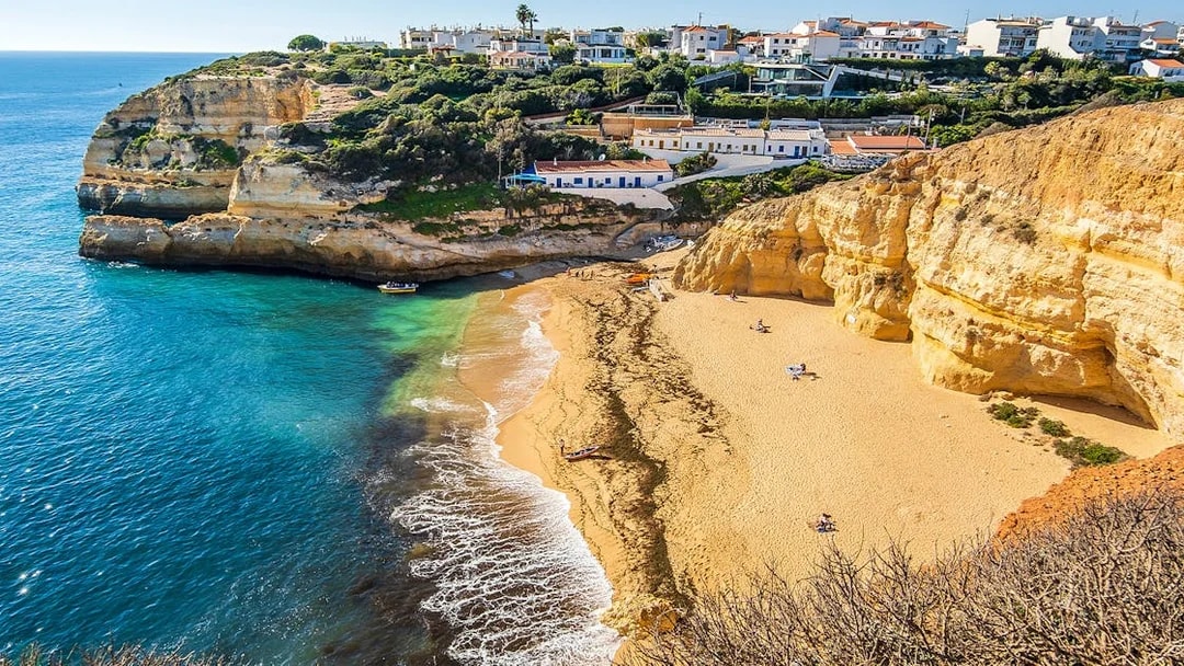 Benagil Caves beach with cliffs and ocean, Portugal, part of Dolphin Discovery tour.