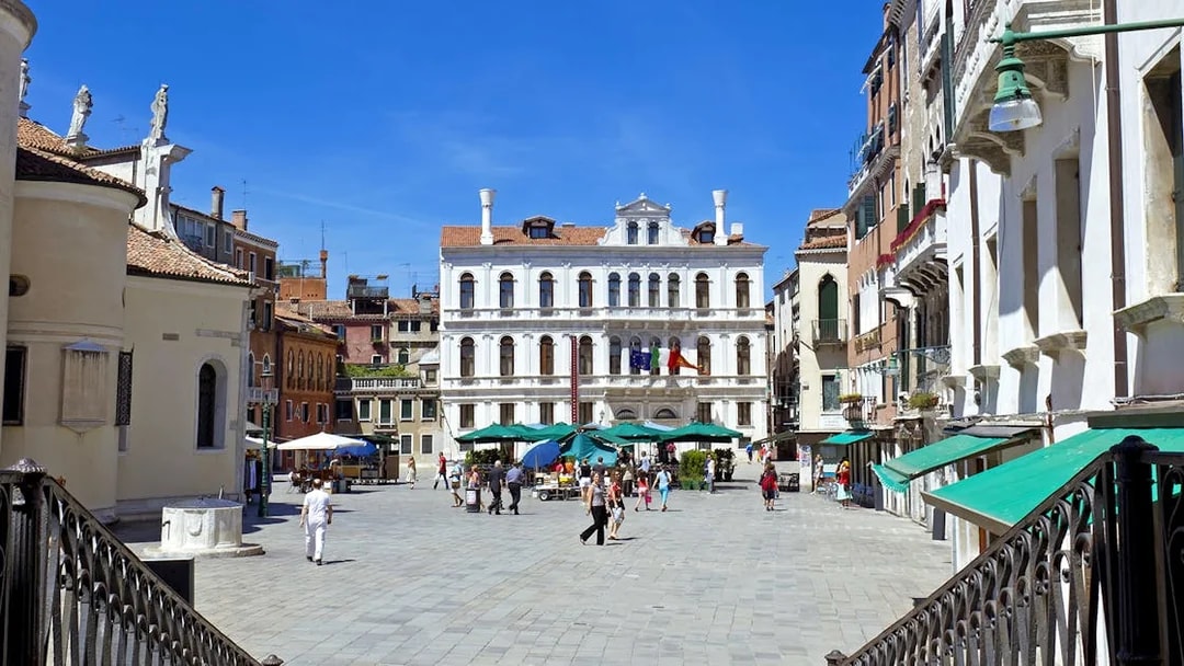 Venice small group tour exploring a historic square with Renaissance architecture.