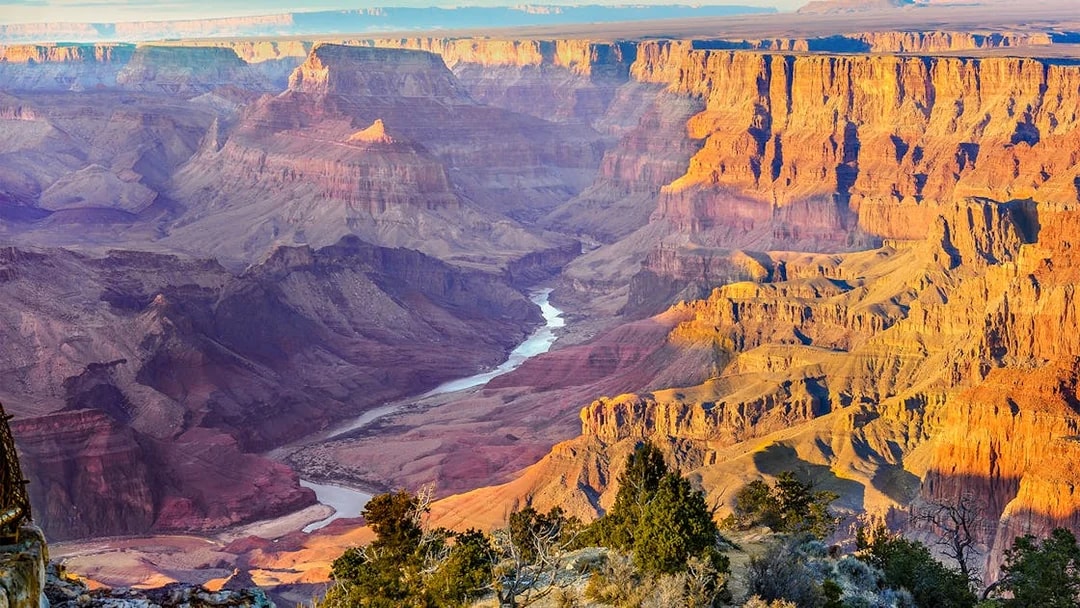 Aerial view of Grand Canyon West with river and rock formations, 20 min airplane tour.