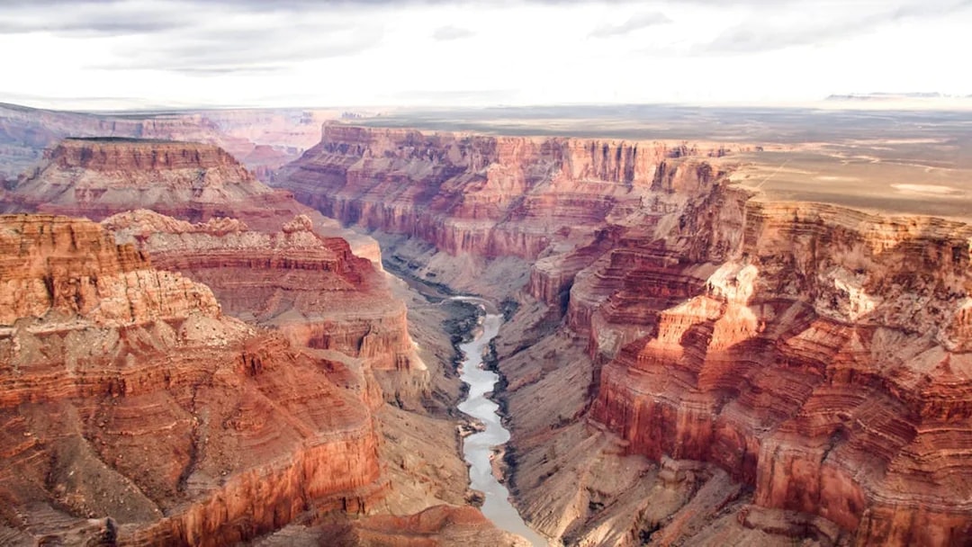 Aerial view of the Grand Canyon's south and north rims with the Colorado River below.