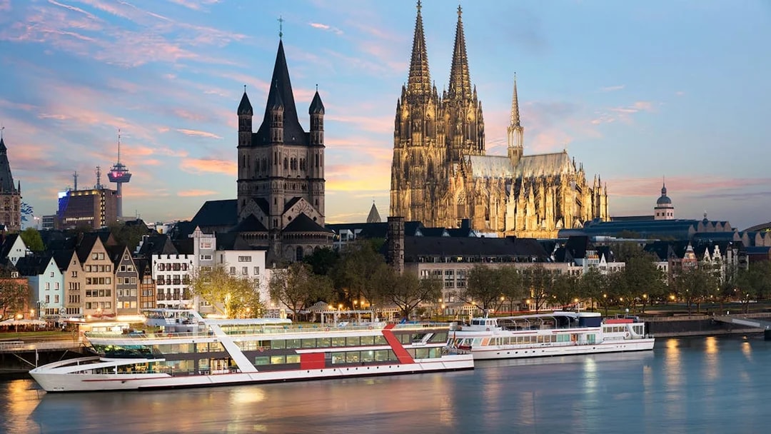 Evening cruise on the Rhine River with Cologne Cathedral in the background.