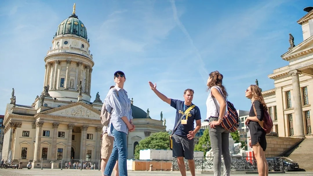 Tour group with guide at Gendarmenmarkt in Berlin.