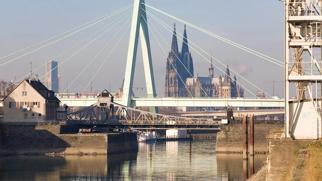 Cologne Harbour with view of the bridge and Cologne Cathedral in the background.