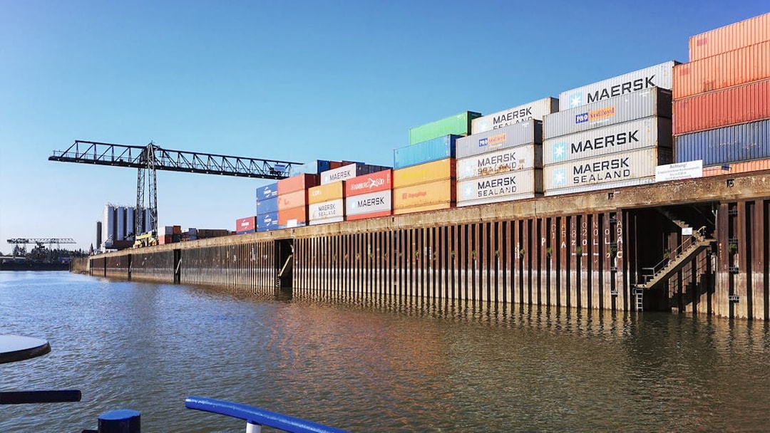 Shipping containers stacked at Cologne Harbour during a boat tour.