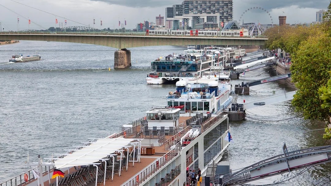 Cologne Harbour with cruise ships docked along the Rhine River.