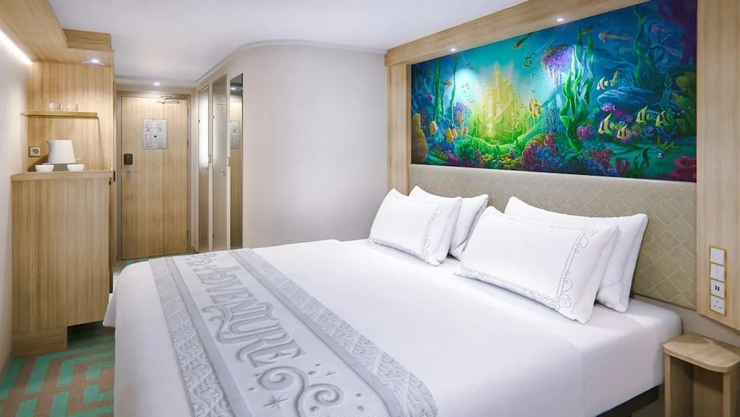 Deluxe Inside Stateroom with reef-themed decor on Disney Adventure Cruise.