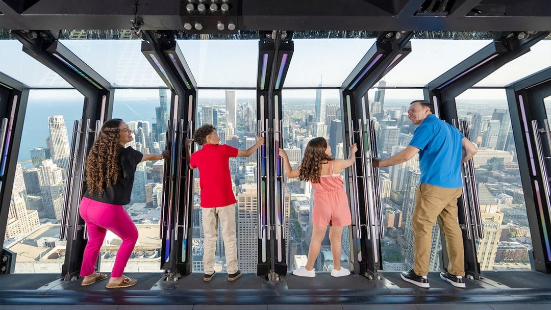 Visitors enjoying the view from Chicago 360 Observation Deck.