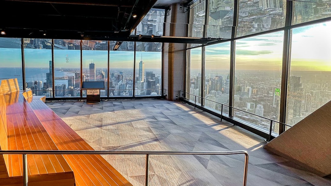 Chicago skyline from 360 Observation Deck with lake and skyscrapers in view.