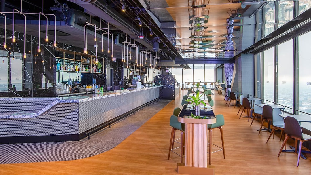 Cloud bar interior at Chicago's 360 Observation Deck with city views.
