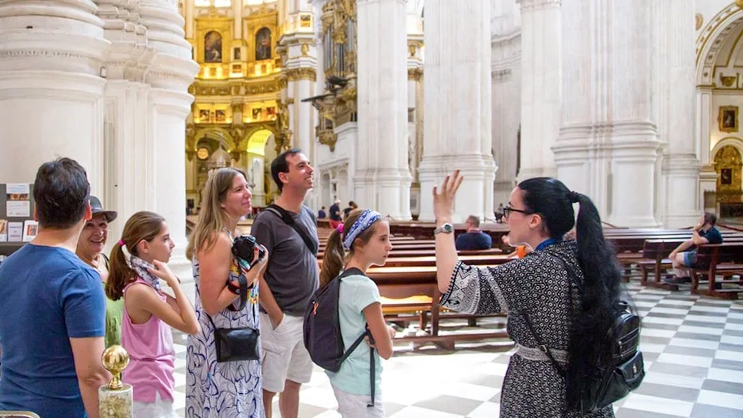 Guided tour group inside Granada Cathedral.