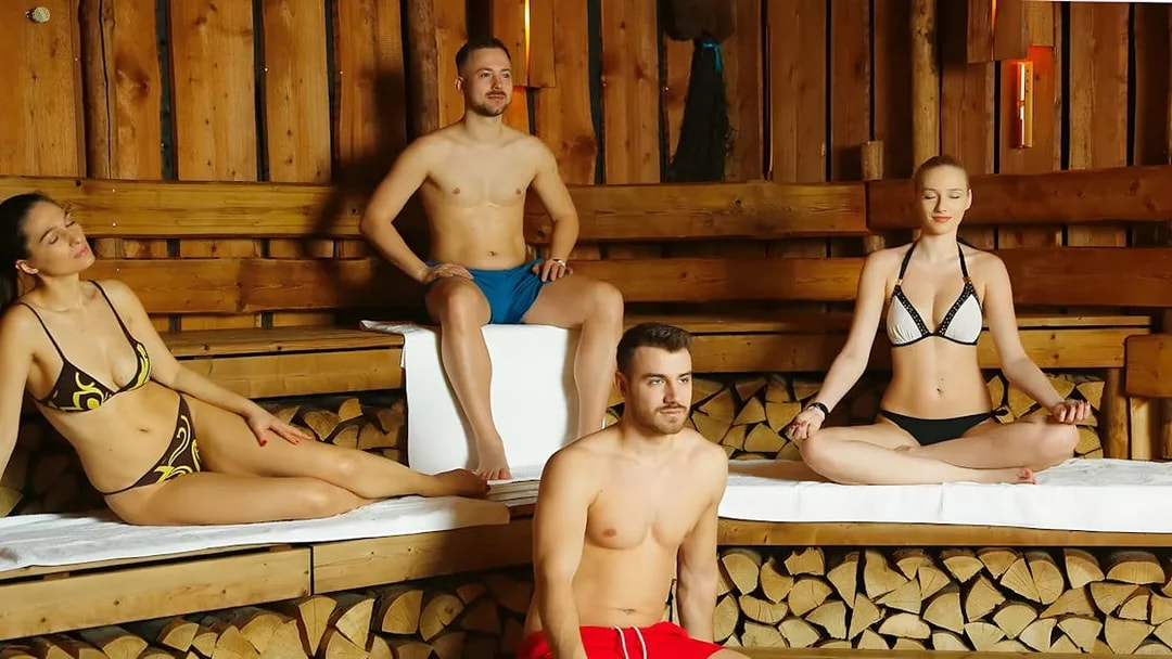 Tourists relaxing in a sauna at Therme Bucuresti Spa, part of a Bucharest combo tour.