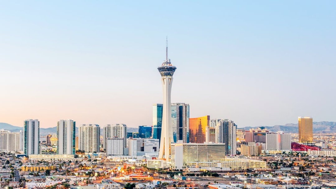 Las Vegas skyline at dusk with Stratosphere Tower, also known as The STRAT Hotel.