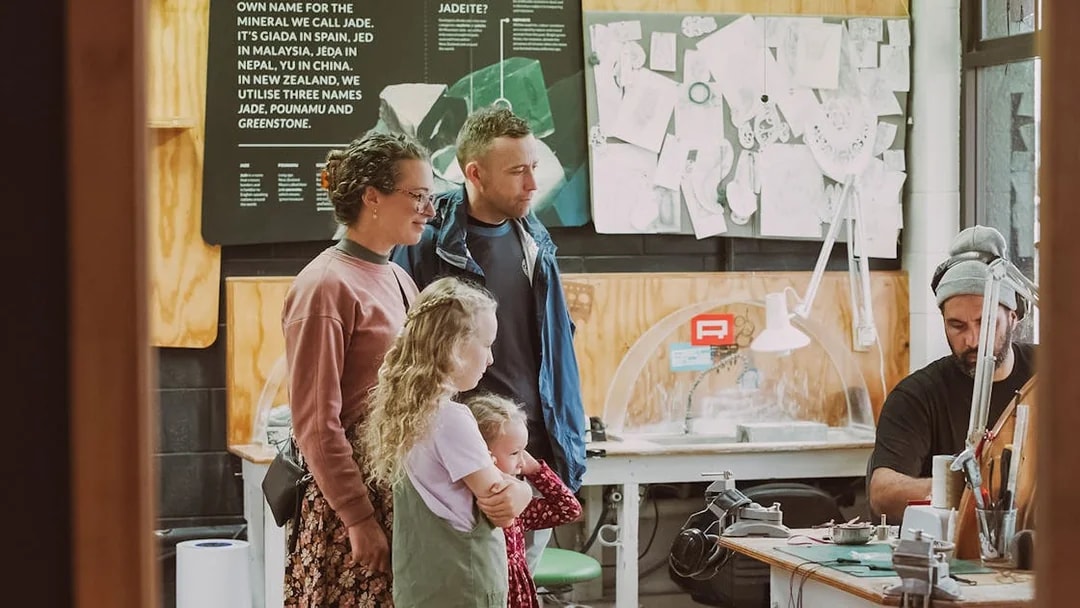 Family observing jade carving process on Mountain Jade Highlights Tour.