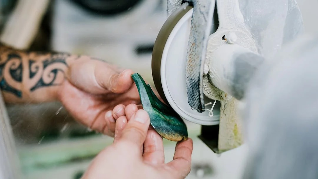 Crafting jade on a grinding wheel during Mountain Jade Highlights Tour.