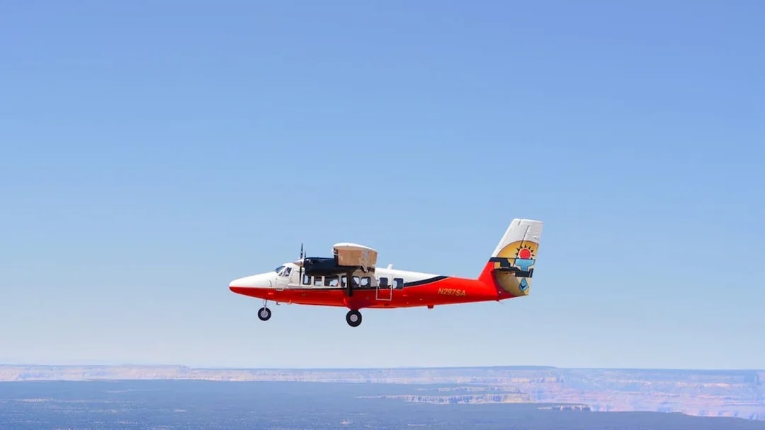 Small plane flying over the Grand Canyon, Arizona.