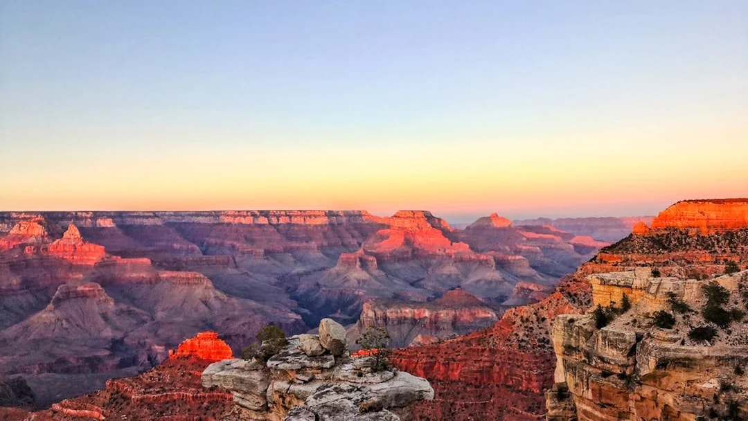 Grand Canyon South Rim at sunset, view from airplane tour.