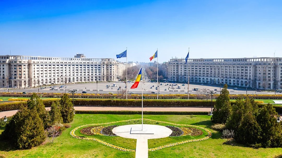 Constitution Square view from Palace of Parliament, Bucharest, with Romanian flag.