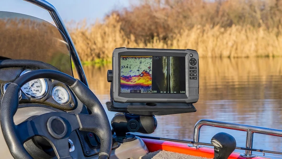 Boat dashboard with sonar display on Loch Ness cruise.
