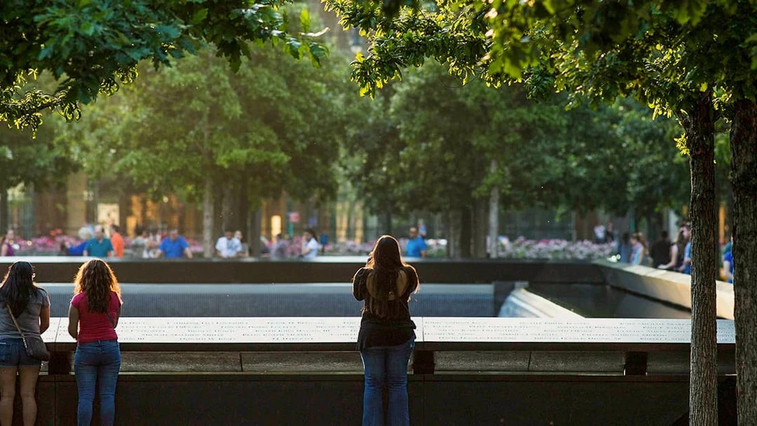Women observing the 9/11 Memorial in New York City.
