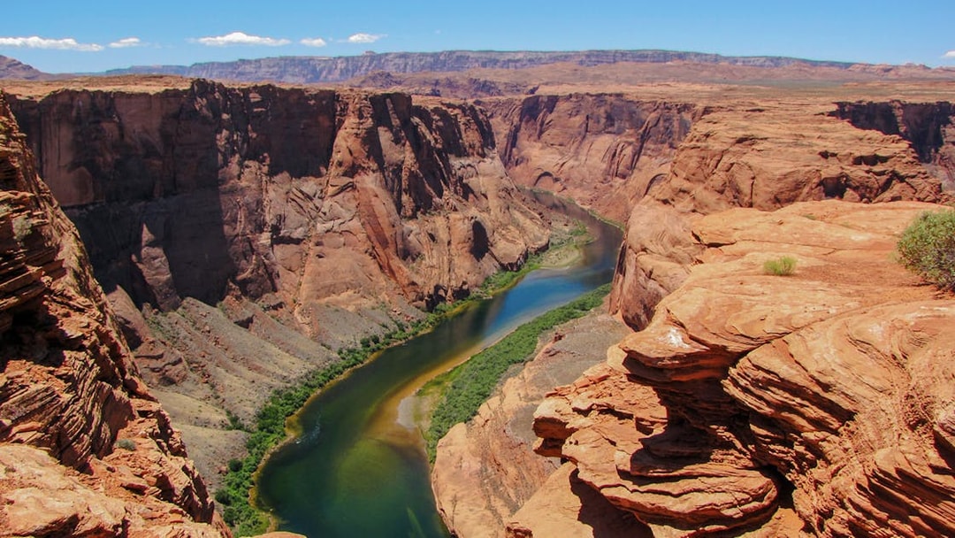 Colorado River winding through the rocky cliffs at the start of the Grand Canyon.