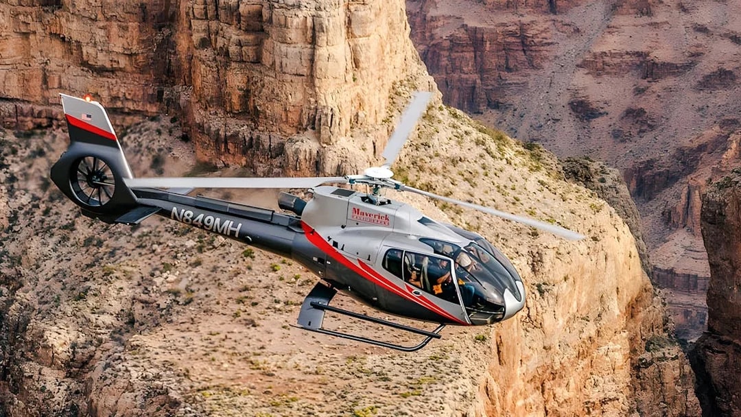 Maverick Helicopters Airbus EC130 flying over the Grand Canyon.