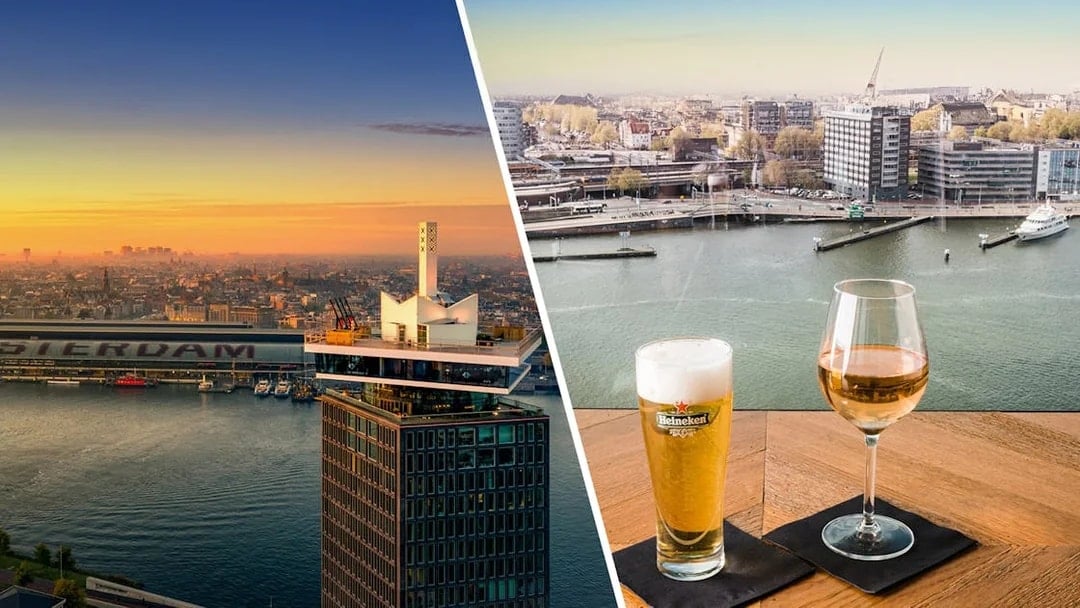 A'DAM Lookout view with Amsterdam skyline and two drinks on a table.