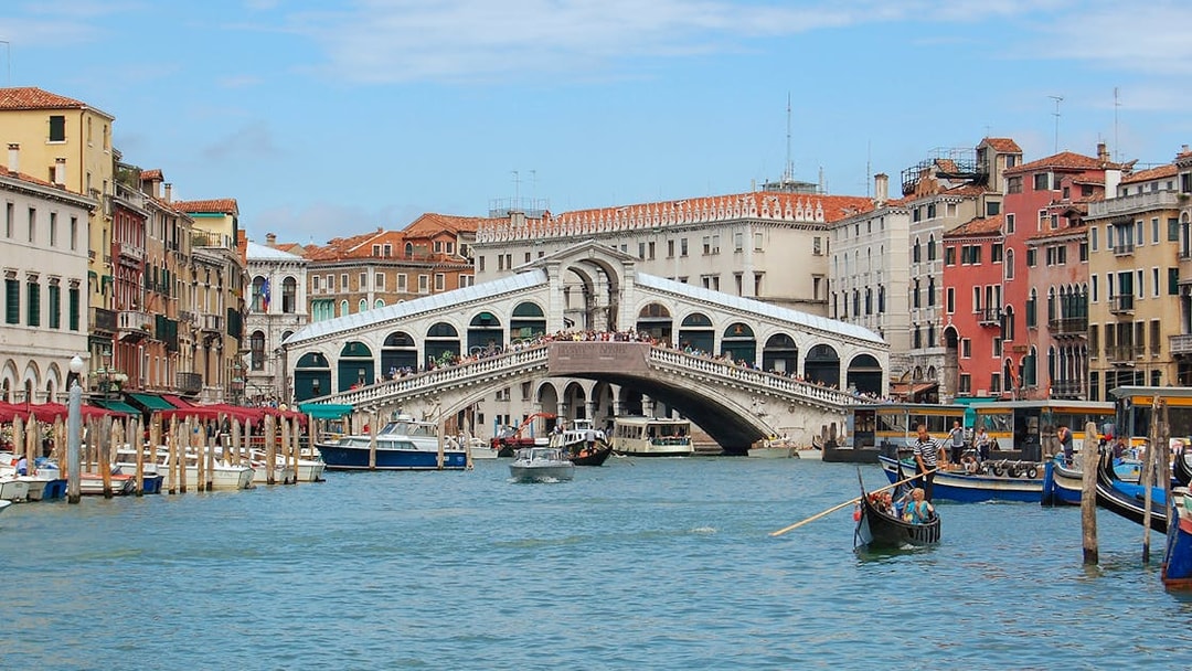 Rialto Bridge over Grand Canal in Venice during guided walking tour.