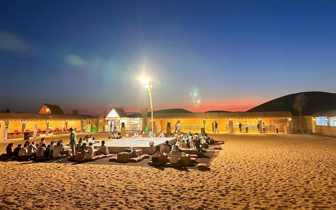Abu Dhabi Evening Desert Safari with 4x4 Dune Bashing, Camel Ride, BBQ Dinner and Live Shows Image 6