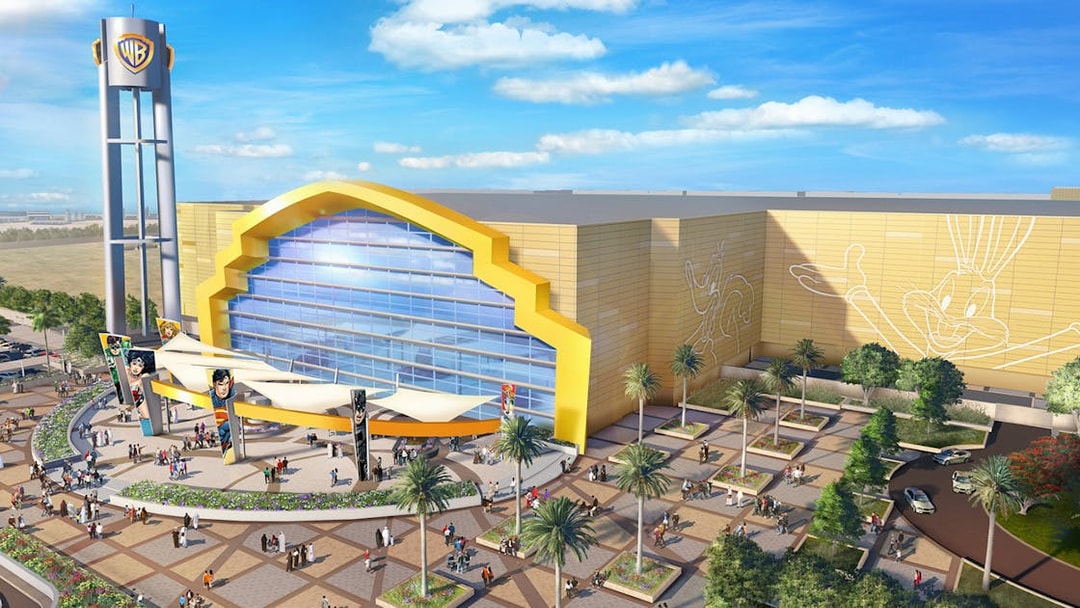 Warner Bros. World Abu Dhabi entrance with visitors, part of guided tour from Dubai.