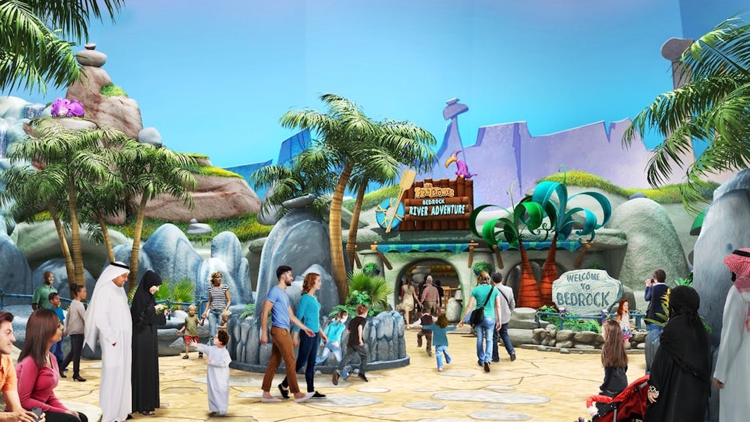 Visitors exploring Warner Bros. Bedrock River Adventure in Abu Dhabi.