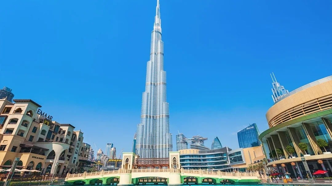 Burj Khalifa and surrounding Dubai skyline on a sunny day during a full day tour.