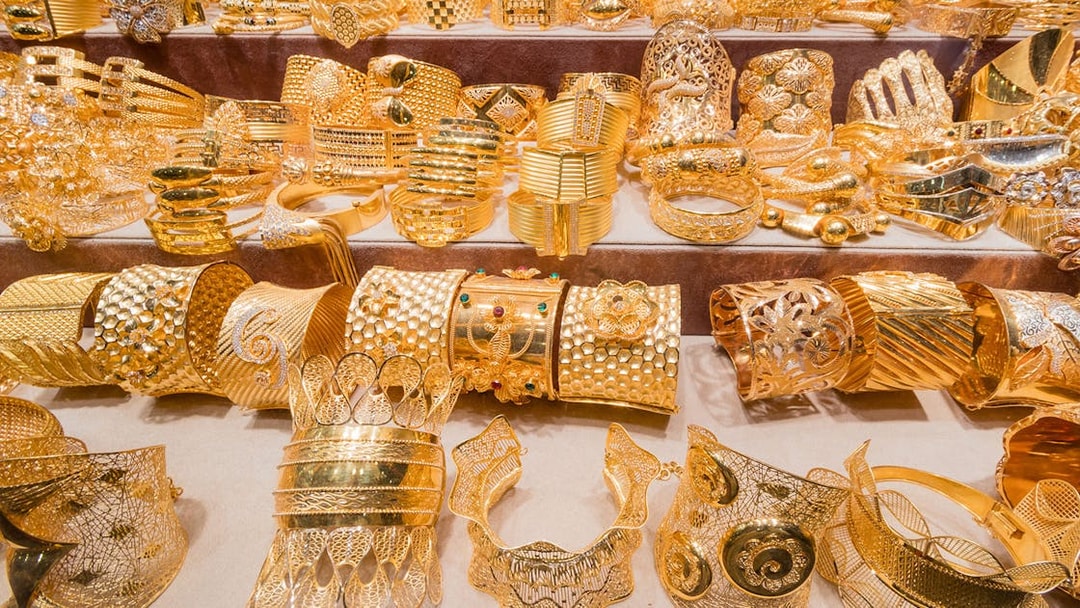 Gold jewelry display at Dubai Gold Souk during full day tour.
