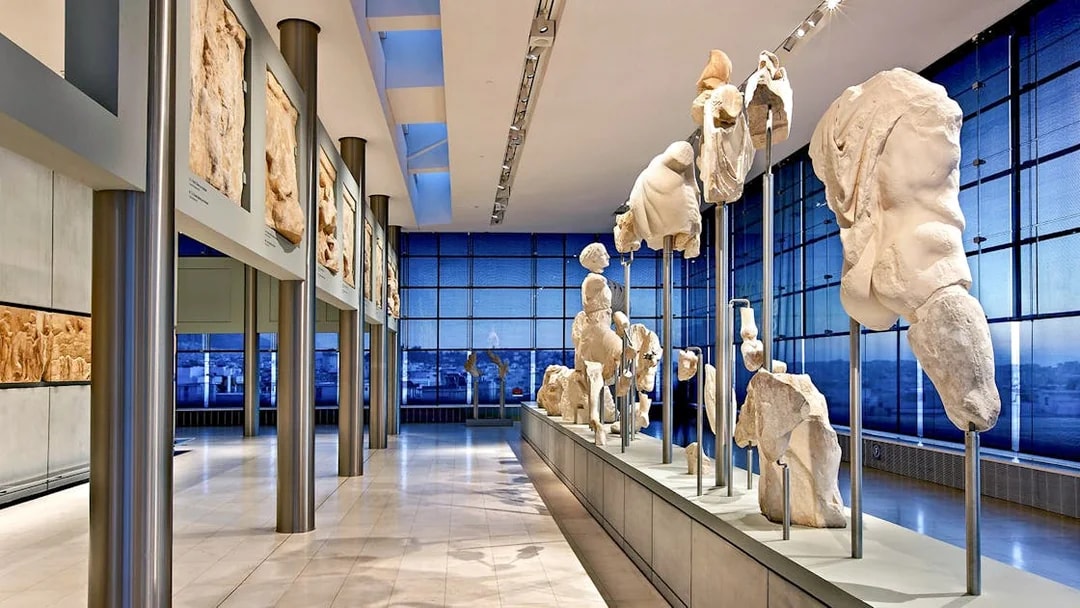 Ancient sculptures displayed in the Athens Acropolis Museum.