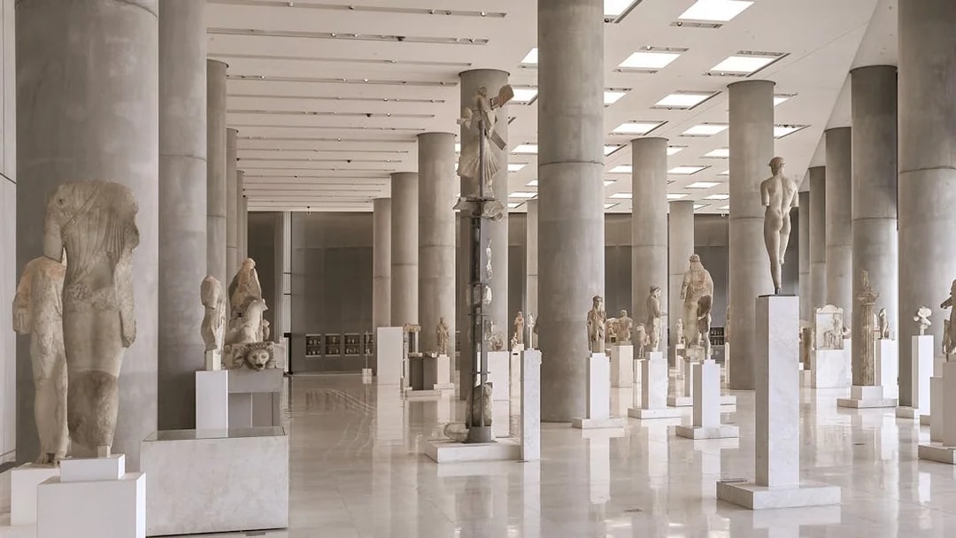 Ancient sculptures in the Athens Acropolis Museum exhibit hall.