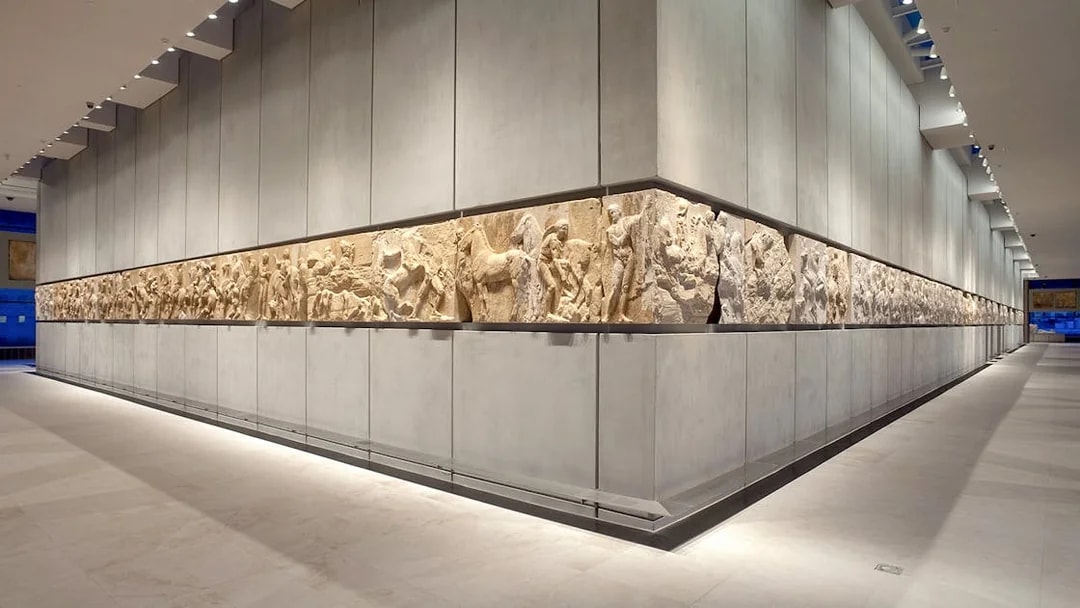 Acropolis Museum frieze display in Athens, Greece, showcasing ancient Greek sculptures.